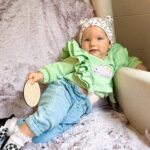 Alicia Banit Instagram – 10 months with our angel!

Plus 6 days woops. But Double digits! Time is flying and I want it to slow down but holy moly this age is fun! She’s discovering new things what feels like daily, she basically has conversations with us, I could swear she says no and she very clearly shows us she isn’t keen on something when she growls. Yes growls. Grrr. It’s hilarious. Her fav mode of transportation is diving headfirst to the floor and rolling, she absolutely wants to walk over crawl, she shakes her head for laughs and Eskimo kisses, clicks her tongue and revs her voice like a motorbike. The girl does not sit still, anything we touch she must also touch, she is SO inquisitive, the cheeky thing has started to climb out of her high chair and my gosh her squishy face smile is EVERYTHING! The squeals and throwing her hands up when she sees her grandparents melts my heart and man that ten month let’s cling to mum thing is REAL! But honestly, I’m cool with it 😍. Oh she’s also started dancing to music. We have a dancer ladies and gents. Lord help us 😂 (but also yay 😁)