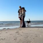 Alicia Banit Instagram – Off on a family walk to the beach with our new BabyBjörn carrier. We haven’t been able to get down there as much as we’d like given that prams don’t love sand! But now being able to walk there with ease and two hands free is a game changer. So stoked to have confidence walking our pup at the same time without having to wrangle him and a pram too! I love these special moments with my lil fam. 
@babybjorn  #babybjornharmony #allinonecarrier #ad