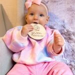 Alicia Banit Instagram - 7 months of our Isla Joy! This little possum has a top tooth, has tried more foods than I can count and babbles MAMA among other words! I’m not sure she knows what she’s saying but I’m claiming it, her first word is definitely mama! She watches our mouths so intently when we try to teach her new words and she’s back in her dinosaur era roaring at everything. She whispers to herself and breathes like darth Vader when she’s bored and I honestly have never met a more smiley, laughable bub. Even through her first cold, our girl didn’t have a single day where she didn’t laugh and smile her way through it. We couldn’t be more in love with her, she is pure perfection 🥹