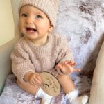 Alicia Banit Instagram - 9 months of our little miss 😍 Girlfriend is a professional clapper and loves to put on a show of waving and clapping most minutes in the day. She’s mastered Dadadada to the delight of Zac and the squeals that come out of her mouth make me think she was a dolphin in a past life. She will blow bubbles with her saliva which is hilarious, I remember sitting there for ages as a kid doing that and whenever she eats, miss independent must feed herself with her spoon. She loves sharing, a game of share the dummy before falling asleep is inevitable and the big sloppy kisses I’ve been getting melt my heart. Which is good cause she has also started scratching and slapping my face when she’s having a cry so honestly, lucky she’s cute. She’s sitting up like a pro Oh and she just casually can point out (specifically with her pointer finger) her favourite family members when you ask her where they are in her pictures on the fridge. Sorry, is my kid a genius or?! This past month her personality has grown so much and I’ve never cried more tears of joy than I do when watching her sleep. She is perfection 🤍