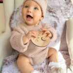 Alicia Banit Instagram - 9 months of our little miss 😍 Girlfriend is a professional clapper and loves to put on a show of waving and clapping most minutes in the day. She’s mastered Dadadada to the delight of Zac and the squeals that come out of her mouth make me think she was a dolphin in a past life. She will blow bubbles with her saliva which is hilarious, I remember sitting there for ages as a kid doing that and whenever she eats, miss independent must feed herself with her spoon. She loves sharing, a game of share the dummy before falling asleep is inevitable and the big sloppy kisses I’ve been getting melt my heart. Which is good cause she has also started scratching and slapping my face when she’s having a cry so honestly, lucky she’s cute. She’s sitting up like a pro Oh and she just casually can point out (specifically with her pointer finger) her favourite family members when you ask her where they are in her pictures on the fridge. Sorry, is my kid a genius or?! This past month her personality has grown so much and I’ve never cried more tears of joy than I do when watching her sleep. She is perfection 🤍