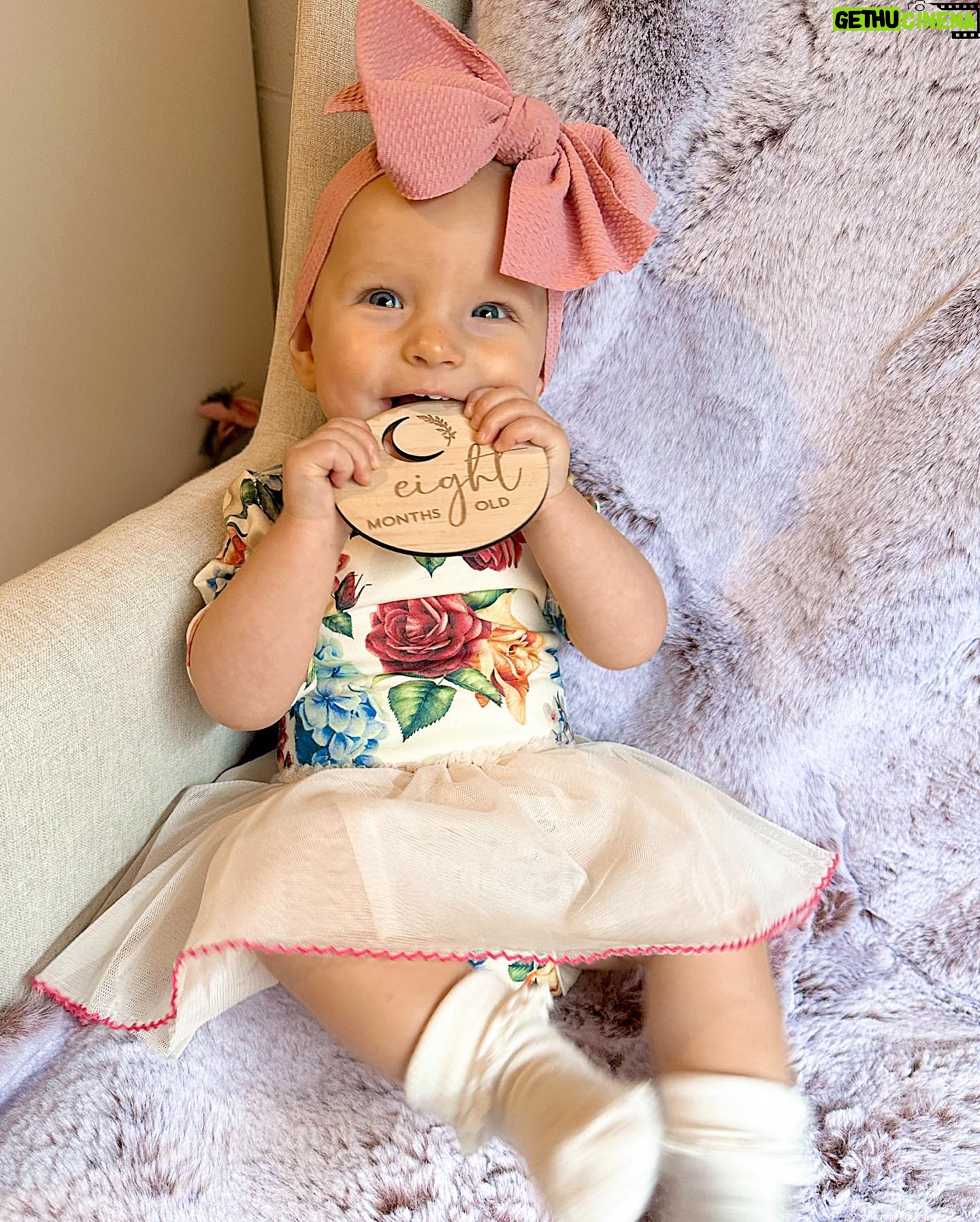 Alicia Banit Instagram - Our Isla Joy is 8 months old! She has a new cheeky smile where she squints her eyes and smiles with her whole face, she has 8 TEETH! with 5 popping through at the same time and surprise surprise she handled it like an absolute champ! She smiles at other people at the shops before they smile at her, she loooves looking at pictures of herself and she’s currently obsessed with waving 🥹 When she cries now she has tears which breaks our hearts but at the same time my god it’s CUTE! and she absolutely adores animals and other children. We still get told every single time we go out that we just have the happiest and chillest lil babe and honestly, I concur. Her personality is growing and evolving every day and we’ve loved nothing more than watching every second of it. My gosh we are the luckiest parents, I do not wish this time away at alllll but I also can’t wait to see who she becomes 🥹🤍