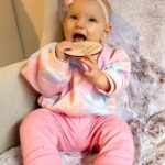 Alicia Banit Instagram – 7 months of our Isla Joy!

This little possum has a top tooth, has tried more foods than I can count and babbles MAMA among other words! I’m not sure she knows what she’s saying but I’m claiming it, her first word is definitely mama! She watches our mouths so intently when we try to teach her new words and she’s back in her dinosaur era roaring at everything. She whispers to herself and breathes like darth Vader when she’s bored and I honestly have never met a more smiley, laughable bub. Even through her first cold, our girl didn’t have a single day where she didn’t laugh and smile her way through it. We couldn’t be more in love with her, she is pure perfection 🥹