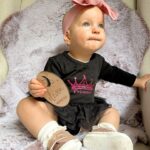Alicia Banit Instagram – Cheeky munchkin is 11 months!

(And a day 😬)Oh my! As if she’s a month away from being ONE?! Every day keeps getting more and more fun, she brings so much joy to every single day! Especially when she’s having a laughing fit and snorts like a piggy! Girlfriend is on the move and crawling/trying to walk, she’s got her first molar with the other nearly through the gum and do I even need to say it? Has handled it like the champ she is! Her new favourite game is pretending to hand something to us to then steal it back, she thinks she’s hilarious! But also, she is. She’s poking her tongue out knowing she’s being cheeky, she loves talking and miss independent is so happy to play alone with her toys. Oh and can stand up in her cot! On the other hand she’s very clingy to mummy right now and loves cuddles. I think she’s actually a crocodile, she has that death roll at nappy change time down pat! She loooves dancing, she could hear music in the other room and will start to jig along to everyone’s delight and she definitely has the Wog gene, she uses her hands very expressively to emphasise the importance of what she’s saying 🤌🏼👈🏼. I can’t believe she’s one next month! The love I have for this little munchkin is indescribable, we are so lucky she’s ours 🤍