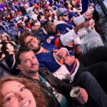 Alicia Witt Instagram - SOMUCHFUN was had this weekend!! what a blast to take a quick jaunt to nyc to watch the @ny_islanders WIN their playoff game against the @canes. now for tomorrow to stay in it! i’ve got my very own team jersey and so does @theimportanceofbeingernesth for good luck ☺️ congratulations to my friend, islanders and @ubsarena owner #jonledecky, and thank you for the most special weekend. also pictured: a whole bunch of @nyjets who were there to cheer us on, especially awesome sauce @malikktaylor who i sat next to for first period - and fellow christmas movie alumnus, @wesbrown225, who was attending as a longtime #islanders fan too!! 🧡💙 #goislanders #hockeyplayoffs