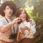 Alie Ward Instagram - True story: for our engagement photos 2 years ago, @jarrett_sleeper was like, what if we do some of them in tiny shorts or giant ballgowns? Absolutely solid strategy. But while @vonswank was taking them, a big green & gold fig eater beetle buzzed by in the @nhmla garden and landed on my finger. This first shot is maybe my favorite because it’s goofy and campy, but so earnest with honesty, wonder & curiosity — things I adore about @jarrett_sleeper. He has the fastest brain and the most generous heart. Today is our anniversary, but every day is learning something new & being rascals. Cut bangs, text your crush, enjoy who you have while you have them. 💖