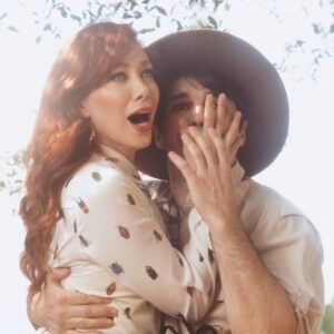 Alie Ward Instagram - True story: for our engagement photos 2 years ago, @jarrett_sleeper was like, what if we do some of them in tiny shorts or giant ballgowns? Absolutely solid strategy. But while @vonswank was taking them, a big green & gold fig eater beetle buzzed by in the @nhmla garden and landed on my finger. This first shot is maybe my favorite because it’s goofy and campy, but so earnest with honesty, wonder & curiosity — things I adore about @jarrett_sleeper. He has the fastest brain and the most generous heart. Today is our anniversary, but every day is learning something new & being rascals. Cut bangs, text your crush, enjoy who you have while you have them. 💖
