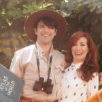 Alie Ward Instagram - True story: for our engagement photos 2 years ago, @jarrett_sleeper was like, what if we do some of them in tiny shorts or giant ballgowns? Absolutely solid strategy. But while @vonswank was taking them, a big green & gold fig eater beetle buzzed by in the @nhmla garden and landed on my finger. This first shot is maybe my favorite because it’s goofy and campy, but so earnest with honesty, wonder & curiosity — things I adore about @jarrett_sleeper. He has the fastest brain and the most generous heart. Today is our anniversary, but every day is learning something new & being rascals. Cut bangs, text your crush, enjoy who you have while you have them. 💖