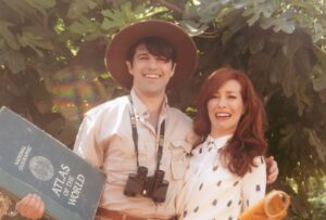Alie Ward Instagram - True story: for our engagement photos 2 years ago, @jarrett_sleeper was like, what if we do some of them in tiny shorts or giant ballgowns? Absolutely solid strategy. But while @vonswank was taking them, a big green & gold fig eater beetle buzzed by in the @nhmla garden and landed on my finger. This first shot is maybe my favorite because it’s goofy and campy, but so earnest with honesty, wonder & curiosity — things I adore about @jarrett_sleeper. He has the fastest brain and the most generous heart. Today is our anniversary, but every day is learning something new & being rascals. Cut bangs, text your crush, enjoy who you have while you have them. 💖