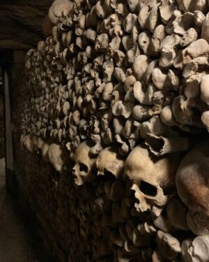 Alie Ward Instagram - Hi. Paris has hundreds of miles of secret abandoned tunnels under the streets and that they are filled with MILLIONS OF PEOPLES BONES. How about that? I interviewed a world expert on the Catacombs: French history professor and author Dr. Erin-Marie Legacey who gave me all the trivia and context. This week’s @ologies episode is up (link in bio) and it explains WHY ARE THE BONES THERE WHAT DO THEY SMELL LIKE WHO ARE THESE PEOPLE, and other questions that my brain was screaming. Enjoy, and Happy Spooktober. Has anyone else been to the Catacombs? How did you feel about them? 💀