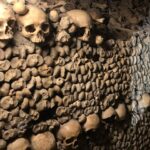 Alie Ward Instagram - Hi. Paris has hundreds of miles of secret abandoned tunnels under the streets and that they are filled with MILLIONS OF PEOPLES BONES. How about that? I interviewed a world expert on the Catacombs: French history professor and author Dr. Erin-Marie Legacey who gave me all the trivia and context. This week’s @ologies episode is up (link in bio) and it explains WHY ARE THE BONES THERE WHAT DO THEY SMELL LIKE WHO ARE THESE PEOPLE, and other questions that my brain was screaming. Enjoy, and Happy Spooktober. Has anyone else been to the Catacombs? How did you feel about them? 💀