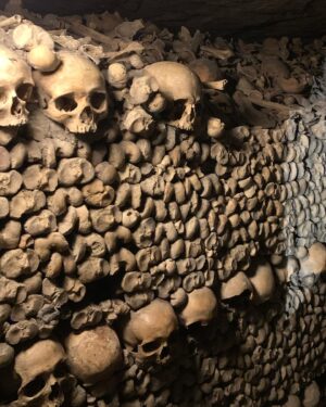 Alie Ward Instagram - Hi. Paris has hundreds of miles of secret abandoned tunnels under the streets and that they are filled with MILLIONS OF PEOPLES BONES. How about that? I interviewed a world expert on the Catacombs: French history professor and author Dr. Erin-Marie Legacey who gave me all the trivia and context. This week’s @ologies episode is up (link in bio) and it explains WHY ARE THE BONES THERE WHAT DO THEY SMELL LIKE WHO ARE THESE PEOPLE, and other questions that my brain was screaming. Enjoy, and Happy Spooktober. Has anyone else been to the Catacombs? How did you feel about them? 💀