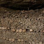 Alie Ward Instagram - Hi. Paris has hundreds of miles of secret abandoned tunnels under the streets and that they are filled with MILLIONS OF PEOPLES BONES. How about that? I interviewed a world expert on the Catacombs: French history professor and author Dr. Erin-Marie Legacey who gave me all the trivia and context. This week’s @ologies episode is up (link in bio) and it explains WHY ARE THE BONES THERE WHAT DO THEY SMELL LIKE WHO ARE THESE PEOPLE, and other questions that my brain was screaming. Enjoy, and Happy Spooktober. Has anyone else been to the Catacombs? How did you feel about them? 💀