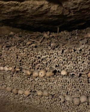 Alie Ward Instagram - Hi. Paris has hundreds of miles of secret abandoned tunnels under the streets and that they are filled with MILLIONS OF PEOPLES BONES. How about that? I interviewed a world expert on the Catacombs: French history professor and author Dr. Erin-Marie Legacey who gave me all the trivia and context. This week’s @ologies episode is up (link in bio) and it explains WHY ARE THE BONES THERE WHAT DO THEY SMELL LIKE WHO ARE THESE PEOPLE, and other questions that my brain was screaming. Enjoy, and Happy Spooktober. Has anyone else been to the Catacombs? How did you feel about them? 💀