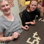 Alie Ward Instagram - This week’s @ologies is… ENIGMATOLOGY, all about word puzzles with NYT crossword writer & magician, @davidkwong. We chatted about crossword clues, Scrabble strategies, anagrams, aging brains, & how to pull off a surprise party. Also this is @jarrett_sleeper’s Grandma Sue. Sue always wins at Banangrams because the woman goes for it and does not hold back. Let’s all be Grandma Sues.