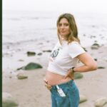 Aly Michalka Instagram - We found out the morning of our sold-out show at The Greek Theatre back in September. Our little one has been on stage with me across three states already and has even done some international traveling! Thankfully with some help from @natalistco, I’ve been able to have a smooth journey. I picked up their product last summer at a pharmacy because I loved that they were plastic neutral and the packaging set itself apart. Their ovulation test kit and pregnancy tests were super easy to use and affordable 😌 Now I’m applying their belly oil daily to keep my tummy nice and hydrated ‘til baby arrives! We’re waiting to find out the gender cuz I’ve always loved a good surprise, but in the meantime we’ve been busy getting the nursery ready, meeting with my birth team, eating more protein than usual, going to Pilates, getting good sleep, and drinking lots of water. Somehow we’ve been able to still spend days in the studio writing music which hopefully finds its way into baby’s soul. I’m so grateful for all the amazing women I’ve leaned on these past 6 months (you know who you are) it makes me hopeful about the goodness in the world 💜 #natalistpartner