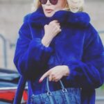 Amanda Lear Instagram – Freezing..fake fur and Dior bag #fashionweek #kimjones #