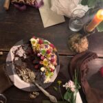 Amanda Palmer Instagram - This is the first time in my life I’ve sat down to have a birthday party while somewhere across the earth, I missed a funeral for a dear friend. At 6pm we laid the table and Ash picked flowers and helped decorated the cake, while somewhere on Palm Beach on Waiheke in Tomorrowland, @danikacharity read the poem I wrote today for Bianca…while everyone over paid their respects to her body. Her life. This is the first time I’ve sat down on a birthday to pen a poem for a death day. There’s a first for everything. This night. These people. Flowers came from afar. I was surrounded by so much love, and the love feels that much more infinite and rich in contrast with the gaping landscapes that are blurry and ragged around the edges. The missing. In death we live. In loss we find our alive. In dark we light. I feel more will to mother knowing that Bianca, right now, cannot. I have never been more grateful for my friends, my loved ones, my lover, my bath soaps, my bedside pens and pencils, my ability to write a poem, my son and his laughter, the blood coursing through my warm hands. My friends. My friends. My friends. Hold your loved ones close tonight. My god, it’s all so fucking brief. To all few hundred of you who joined the Patreon togay, welcome to the family. It’s a good one. Good night. I’ll never feel a day like this again on earth. ♥️🥀