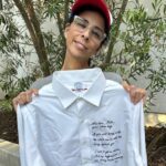 Amanda Palmer Instagram - It wasn’t me who chose the lyric, but “I’d like to do more than survive, I’d like to rub it in your face” for a quote to be embroidered on a shirt to raise funds for Abortion Access Front (@abortionfront) seems very logical. I am HONORED AF to be joining forces with @sarahkatesilverman, @jamieleecurtis, @margaret_cho, @stevienicks, @sandragbernhard, @nekocaseofficial, @busyphilipps and more to raise funds for this critical cause. All of us provided a quote, the quote was embroidered onto a vintage shirt, and all the shirts are up for auction. The auction closes May 16th so go FAST and bid. Your dollars will towards the endless battle to make sure people can access safe and legal abortion in our country. It’s getting more and more important every day. Dig deep and bid high. If you win this shirt and bring it to a show I promise I will personally also make it out to you and draw a dick on it if you want. Link to the auction in stories and in the @abortionfront feed. Thanks to @mwmccomiskey for taking the shots of me and to @lizzwinstead for putting this epic idea together. GO BID.