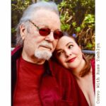 Amber Tamblyn Instagram - "I grew up in Southern California in an apartment building complex where I’d often spend evenings around a communal bonfire listening to my father, the artist, and acrobatic dancer, Russ Tamblyn, tell stories about the heydays of Hollywood. My dad starred in everything from the original West Side Story, to David Lynch’s Twin Peaks, rubbed elbows with the likes of Fred Astaire and Henry Miller, and is a beloved culture icon of sorts. You could hear a pin drop - or just the sounds of the crackling fire and my father’s voice - as neighbors and friends alike leaned in to listen closely to his stories of the adventures from his youth. There was the time he received his best friend, the actor Dennis Hopper, in bad shape over the border of Mexico in an ambulance. Or the time he picked up a strange hitchhiker who turned out to be Charles Manson, and his harem of women in Topanga. Or the time he helped Elvis Presley with some dance moves for “Jailhouse Rock.” Or the time his other best friend, the songwriter Neil Young, wrote one of his most famous songs in the backseat of dad’s car on a road trip. Or the time dad turned down that lead role in “Gilligan’s Island.” Or the second time he met the Queen of England. Those stories are just a fraction of his life, and what he writes about in his new memoir, Dancing on the Edge: A Journey of Living, Loving, and Tumbling Through Hollywood. At 89 years old, I like to think it’s a pretty amazing feat, to have come this far, literally and professionally; to have lived for so long, and so hard, and so good, as my dad has, and get to publish a book about it—his first book!— in his golden years. May we all be so fortunate. (Especially the living part.) For The Bare Magazine, I sat down with my dad in my backyard in Brooklyn, New York during his recent press tour for the book to talk about some of his favorite memories from growing up in Hollywood, thinking about life’s biggest regrets at the end of the road, and of course, the essential products he can’t live without (spoiler alert: one of them is a cologne he has worn since I was born, and still wears to this day.)" -- @amberrosetamblyn @officialrusstamblyn ♥️ #linkinbio
