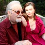Amber Tamblyn Instagram - "I grew up in Southern California in an apartment building complex where I’d often spend evenings around a communal bonfire listening to my father, the artist, and acrobatic dancer, Russ Tamblyn, tell stories about the heydays of Hollywood. My dad starred in everything from the original West Side Story, to David Lynch’s Twin Peaks, rubbed elbows with the likes of Fred Astaire and Henry Miller, and is a beloved culture icon of sorts. You could hear a pin drop - or just the sounds of the crackling fire and my father’s voice - as neighbors and friends alike leaned in to listen closely to his stories of the adventures from his youth. There was the time he received his best friend, the actor Dennis Hopper, in bad shape over the border of Mexico in an ambulance. Or the time he picked up a strange hitchhiker who turned out to be Charles Manson, and his harem of women in Topanga. Or the time he helped Elvis Presley with some dance moves for “Jailhouse Rock.” Or the time his other best friend, the songwriter Neil Young, wrote one of his most famous songs in the backseat of dad’s car on a road trip. Or the time dad turned down that lead role in “Gilligan’s Island.” Or the second time he met the Queen of England. Those stories are just a fraction of his life, and what he writes about in his new memoir, Dancing on the Edge: A Journey of Living, Loving, and Tumbling Through Hollywood. At 89 years old, I like to think it’s a pretty amazing feat, to have come this far, literally and professionally; to have lived for so long, and so hard, and so good, as my dad has, and get to publish a book about it—his first book!— in his golden years. May we all be so fortunate. (Especially the living part.) For The Bare Magazine, I sat down with my dad in my backyard in Brooklyn, New York during his recent press tour for the book to talk about some of his favorite memories from growing up in Hollywood, thinking about life’s biggest regrets at the end of the road, and of course, the essential products he can’t live without (spoiler alert: one of them is a cologne he has worn since I was born, and still wears to this day.)" -- @amberrosetamblyn @officialrusstamblyn ♥️ #linkinbio