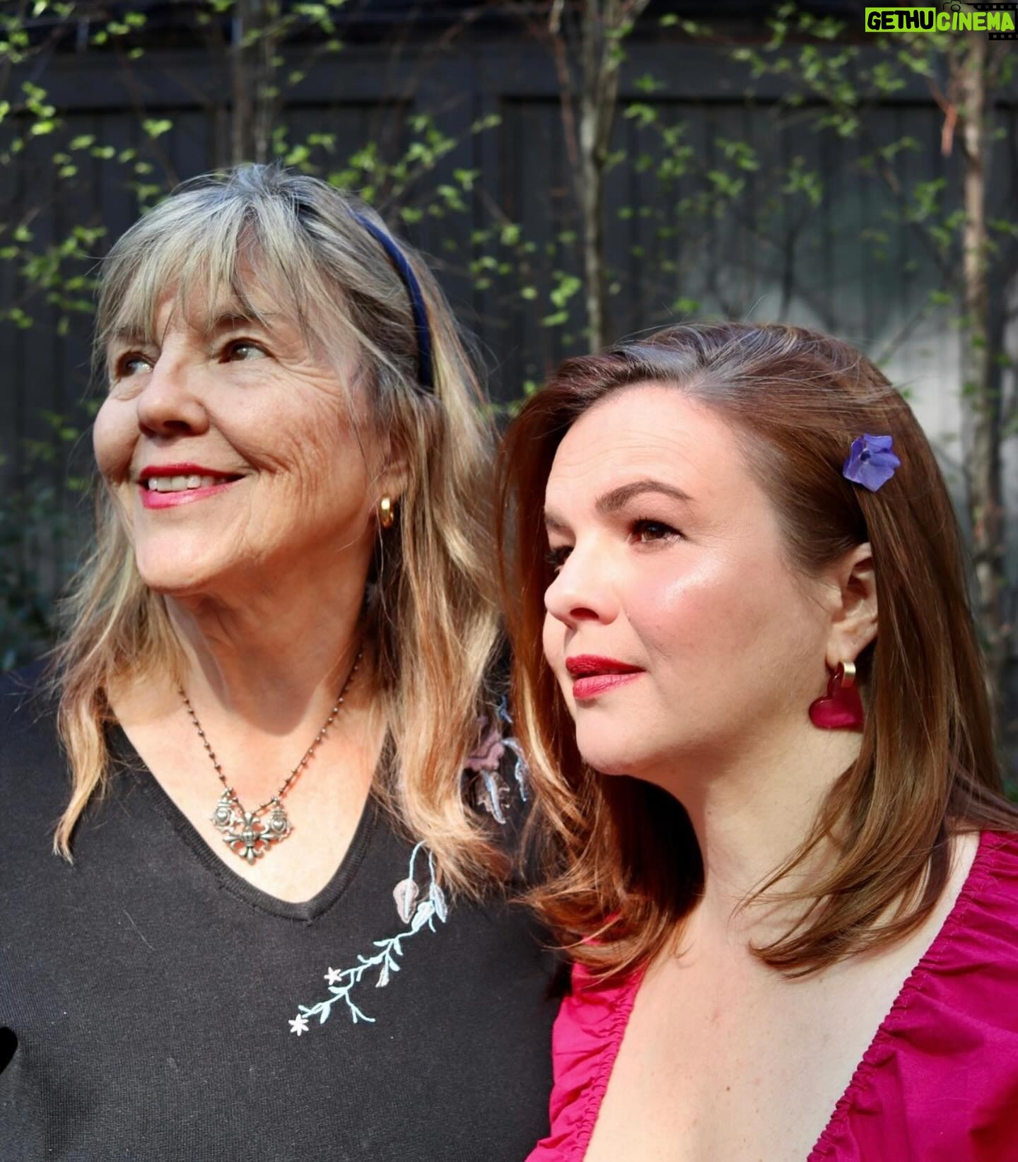 Amber Tamblyn Instagram - *Sings in the key of Maya Rudolph* SHE’S. MY. MOTHER. Happy birthdays to me and my mom @bonnietamblyn (mine’s today, hers is tomorrow May 15th.) In honor of her birthday, please check out or donate to @topainstitute (The Ojai Foundation) an organization gathering leaders, facilitators, artists, teachers and students in honoring global traditions of perennial wisdom that create peace, healing, art, learning, and most importantly: listening. This organization has been my mom‘s life work, and the world is better off for it. Happy birth, birthed, and birthing days to us! I love you so much mom! 🌺 📸 of me and my mom: @tina_turnbow Dress by @ruesaintpaul Matching purple flowers in our hair: my daughter Marlow