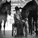 Amberley Snyder Instagram - 🖤 Sometimes it feels like I’ve only been in this chair a short time. Other days the weight of fourteen years is barely one I can bear. I will not tell you it gets easier or choosing positivity is a simple task. Because truthfully, it is hard. There are days I forget and I’ll ask my legs to move or reach for something and fall. Those moments I am harshly reminded of my reality. Where would I be? If I had kept my seatbelt on or not looked at my map. I am asked often, “What if? Why did you? Do you wish you hadn’t?” What am I supposed to say. Does it really matter?! I cannot change it. Healthy people do not make choices knowing it will send them spiraling in another direction. You don’t choose to lose what I lost. What I have experienced, faced and overcome has pushed me to limits I don’t ever want to relive. This chair is my life to live and my burden to carry. No one can do it for me nor can they feel what I do. God gave me this path and He knows what it takes to be me. Many moments I remind myself “Someone is praying for what I have.” I have family, friends, and followers who love me, care for me and support me beyond measure. I have a purpose to serve both in the arena and on speaking stages across this nation. I have been given a platform to share my story and in turn literally save and change lives. What a life! What a privilege! What a journey it has been! 14 years full of every emotion-the good and the bad. But a journey I am grateful to be on. I’ve made it this far… so i might as well begin another! Here’s to the next one 🫶🏻 #amberleysnyder #walkriderodeo