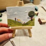 Amy Huberman Instagram - Dinky McDinker Dinkletons teeny tiny canvases and easels 🥹 I’ll just be here painting squinchy miniature paintings for the foreseeable. If not longer. I might even sit out on the road on a giant chair with my mini easel just painting scenes to confuse literally everyone. (Ps got these in Sostrene &Grene. I cannot.)