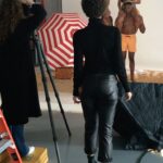 Amy Sherald Instagram - Behind the scene of the shooting Precious Jewels by the Sea. Wanted to make a painting on the beach and it was the middle of winter so we improvised with many many bags of sand. I really only like shooting outside in natural light but it was Jan in NY. 15 min in I realized that the multi-task of being behind the camera and directing the models pose by pose( while looking for the painting composition in the process) was a little difficult so my trusted friend and talented photographer @melaniedunea photographed while I focused on the subjects and creating the image I wanted 🤪 #art #painter #hauserandwirth #amysherald #paintersprocess #studio #beachday also starring my assistant @kelliryan ☺️