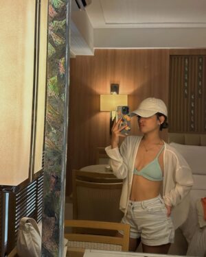 Andi Abaya Instagram - munch, swim & repeat 😝