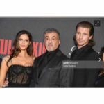 Andrea Savage Instagram - So thrilled to be in nyc for the @tulsaking premiere!! What a fantastic night!! I truly felt incredible. ❤️ The last two pics I added because they made me chuckle. One we all look like wax statues and the other @officialslystallone and I clearly are finding something hilarious that @garretthedlund is not amused by. 🤣🤣 No clue what it was! Holy crap, only two days away from the premiere 11/13 on @paramountplus And I have to just say a HUGE thank u to the village that made me feel like a million bucks, after taxes. A magical night!! #tulsaking Stylist: @taraswennen Makeup: @rebeccarestrepo Hair: @matthewmonzon Dress: @dolcegabbana Shoes: @stuartweitzman Jewelry: @simandroz