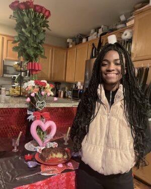 Aniela Gumbs Instagram - Hope you had a great Valentines Day 💕💕💕 
I turned 15 and I’m old 😂 #anielagumbs hugs and kisses to you #kisses #chocolate #hugs #snuggles #zola #like #comment #follow #valentinesday #birthday #fit #cute #carnations #love