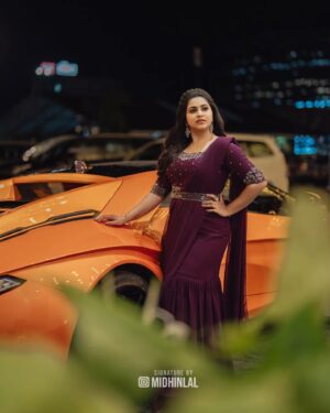 Ankhitha Vinod Instagram - 𝐀𝐥𝐰𝐚𝐲𝐬 𝐏𝐮𝐫𝐩𝐥𝐞 💜✨
.
📽️ : @midhinlal
👗 : @aalaadesigners
💄: @sivas_makeover_
.
#purple #heeriye #sareegown #marriage #dcavanti #reception #actor #celebrity #celebration #celebritywedding #lovemarriage #trending #picoftheday #withthetrend