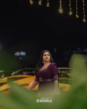 Ankhitha Vinod Instagram - 𝐀𝐥𝐰𝐚𝐲𝐬 𝐏𝐮𝐫𝐩𝐥𝐞 💜✨
.
📽️ : @midhinlal
👗 : @aalaadesigners
💄: @sivas_makeover_
.
#purple #heeriye #sareegown #marriage #dcavanti #reception #actor #celebrity #celebration #celebritywedding #lovemarriage #trending #picoftheday #withthetrend