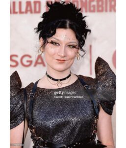 Anna Brisbin Instagram - The Hunger Games: The Ballad of Songbirds and Snakes…. sksksjsjjsjssnbsbd where to BEGINNNNN??!?!?! This premiere was everything. I adored the Hunger Games books and movies and never thought we’d be BACK IN PANEM but as horrendous and bloodthirsty as it is, IT FEELS SO GOOD TO BE BACK. 😂 And this movie is BEAUTIFUL. Watching Coriolanus Snow become who he’s destined to be is FASCINATING I LOVE A VILLAIN ORIGIN STORY. Tom Blyth killed it as Corio, and Dr. Gaul is probably my fav Viola Davis role ever, but I think *everyone* will be even more blown away by RACHEL FREAKIN ZEGLER and her STTTUUNNNINNGGG, INSPIRING, WONDERFUL, TALENTEDBRILLIANTINCREDIBLEAMAZINGSHOWSTOPPINGSPECTACULAR Lucy Gray Baird!! That girl can SING and BREAK YOUR HEART in two seconds flat! 💜🎙️🕊️✨ @tomblyth @violadavis @rachelzegler This story is gripping from beginning to end. Which is impressive because baby she’s LONGGG. I feel like I just watched a whole trilogy in one sitting but I LOVED IT. 😍🕊️🐍✨ Thank you thank you thank you @lionsgate for the invite to the premiere. For dress code you said “Capitol Chic” and I asked myself What Would Cinna Do. 💛✨ Now brb I’m going to binge the original movies IMMEDIATELY. @thehungergames #LionsgatePartner #TheHungerGames #TheBalladOfSongbirdsAndSnakes