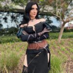 Anna Brisbin Instagram - Gave my Yennefer cosplay from The Witcher 3 some serious upgrades and put it all together for Comic Con. And she just might be one of my fav cosplays so far? Idk but I’m def not done with her. Gotta bring her to ren faire or something…. Photo: @tessanetting Top and Skirt: ShopCosplayCostume on etsy Corset and waist belt: CraftShopMorgana on etsy Knee Armor: file by @victoriahofferson, printed by @jameschatstv Purple contacts: @pinkyparadisedotcom #yennefer #sdcc #comiccon #witcher #witcher3 #cosplay