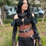 Anna Brisbin Instagram - Gave my Yennefer cosplay from The Witcher 3 some serious upgrades and put it all together for Comic Con. And she just might be one of my fav cosplays so far? Idk but I’m def not done with her. Gotta bring her to ren faire or something…. Photo: @tessanetting Top and Skirt: ShopCosplayCostume on etsy Corset and waist belt: CraftShopMorgana on etsy Knee Armor: file by @victoriahofferson, printed by @jameschatstv Purple contacts: @pinkyparadisedotcom #yennefer #sdcc #comiccon #witcher #witcher3 #cosplay