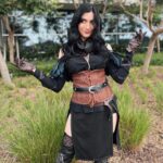 Anna Brisbin Instagram - Gave my Yennefer cosplay from The Witcher 3 some serious upgrades and put it all together for Comic Con. And she just might be one of my fav cosplays so far? Idk but I’m def not done with her. Gotta bring her to ren faire or something…. Photo: @tessanetting Top and Skirt: ShopCosplayCostume on etsy Corset and waist belt: CraftShopMorgana on etsy Knee Armor: file by @victoriahofferson, printed by @jameschatstv Purple contacts: @pinkyparadisedotcom #yennefer #sdcc #comiccon #witcher #witcher3 #cosplay