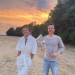 Anna Friel Instagram - Summer time- family time. Me and my brother Michael. He doesn’t do social media. I love him so much. A wonderful doctor and a fabulous father. Sunset ain’t too bad either. #siblinglove ❤️❤️❤️