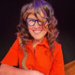 Annabel Crabb Instagram - Pretty great highlight of this afternoon at World Science Festival…. Getting to meet Netflix, one of approx 2 dozen snakes who live with the magical @cnzdenek whose other hobby is hiding in bushland to film Palm Cockatoos, the only bird in the world to use tools to make music (it’s a sex thing). Anyway Netflix the snake likes burrowing in hair and found a lot to work with when we met. She also (on stage) slithered inside my dress, around my back and out my left dress sleeve. @leigh_sales (who is cautious around snakes) was a bit edgy. But we also got to meet an ASTRONAUT @astro.woody so yeah. A day when you meet someone who’s orbited the earth nearly 3000 times, plus get to a solid second base with a lovely lady snake … I do love my job. @natalijarushidi have you heard from any other customers that this dress is unusually snake-attracting? Might be worth keeping an eye on that