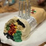 Annabel Crabb Instagram – JUST LOOK at the burrito cake @glamgwenblake made at the request of her daughter. The corn is made from chopped up banana lollies. The silver foil is EDIBLE. The rice is rice bubbles tossed in melted white chocolate. A thing of delight. Happy birthday Honor. ❤️ ps this is Gwen’s photo, I took a bunch but none of them came out as nicely as Gwen’s for reasons that should be obvious haha. @chat10looks3