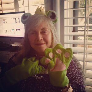 Anne Rice Instagram - Every Christmas Anne’s dear friend, writer @ericshawquinn, brings her a different type of frog prince statue for every day that he stays with her for the holidays. Typically he brings small statues and figurines, but this year he spiced things up with some “frog prince cosplay” which Anne proudly adorned at the breakfast table. This tradition was inspired by the late Stan Rice, who used to refer to the New Orleans Rice residence as “Toad Hall.” #authorsofinstagram #writersofinstagram #annerice #lestat #frogprincesofinstagram