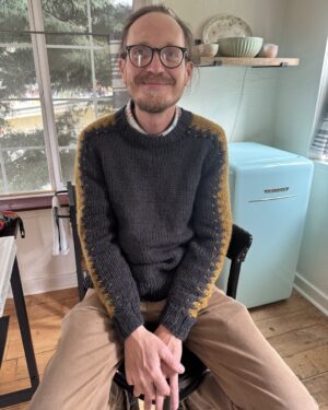 Annette O'Toole Instagram - This is my son-in-law Kevin O’Briant. This is his new sweater made by me. Pattern from a Vogue Knitting magazine from 1966.
