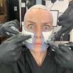 Annie Wersching Instagram - Sick of #Picard posts yet? 😉👑👽Never, you say?! Great! In honor of our panel at @wondercon today, this one goes out to the incredible artists who designed, executed and applied this tricky prosthetic. In the beginning I was called 4 hours before I was due on set. That included everything…hair in a bun, bald cap, crown on, 10 overlapping prosthetics, airbrushing and hand painting. Then costume and corset and all the rest. We very quickly got the whole shebang down to 2 1/2 hours! I’d go film some snarky BQ scenes and then it would take about 25 mins to remove the makeup pieces. I would let my hubs/family know I was almost finished by sending one of these ridiculous pics of prosthetics being cut off my face! 🤣 Some of my favorite times throughout my whole #StarTrekPicard experience were sitting in the chair being worked on by @jrmackinnon amd @kevinkirkpatrickart. I mean….what talent! And what great humans.❤️@vincentvandykefx and his team created piece after piece and @nevillepage was the concept artist for the whole thing! They did all of this while under the strictest of Covid protocols. I applaud them tremendously and I’m sure they’ll win lots of Emmys. 🏆 As they should! Don’t even get me started on @christineclarkdesign and @syzygy_designs and their ridiculously amazing detailed fittings and BQ costume…We’ll save that for next week ;) @startrek @startrekonpplus #picardbts