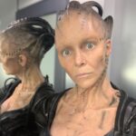 Annie Wersching Instagram - Sick of #Picard posts yet? 😉👑👽Never, you say?! Great! In honor of our panel at @wondercon today, this one goes out to the incredible artists who designed, executed and applied this tricky prosthetic. In the beginning I was called 4 hours before I was due on set. That included everything…hair in a bun, bald cap, crown on, 10 overlapping prosthetics, airbrushing and hand painting. Then costume and corset and all the rest. We very quickly got the whole shebang down to 2 1/2 hours! I’d go film some snarky BQ scenes and then it would take about 25 mins to remove the makeup pieces. I would let my hubs/family know I was almost finished by sending one of these ridiculous pics of prosthetics being cut off my face! 🤣 Some of my favorite times throughout my whole #StarTrekPicard experience were sitting in the chair being worked on by @jrmackinnon amd @kevinkirkpatrickart. I mean….what talent! And what great humans.❤️@vincentvandykefx and his team created piece after piece and @nevillepage was the concept artist for the whole thing! They did all of this while under the strictest of Covid protocols. I applaud them tremendously and I’m sure they’ll win lots of Emmys. 🏆 As they should! Don’t even get me started on @christineclarkdesign and @syzygy_designs and their ridiculously amazing detailed fittings and BQ costume…We’ll save that for next week ;) @startrek @startrekonpplus #picardbts