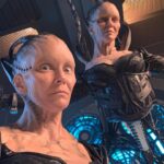 Annie Wersching Instagram - Sick of #Picard posts yet? 😉👑👽Never, you say?! Great! In honor of our panel at @wondercon today, this one goes out to the incredible artists who designed, executed and applied this tricky prosthetic. In the beginning I was called 4 hours before I was due on set. That included everything…hair in a bun, bald cap, crown on, 10 overlapping prosthetics, airbrushing and hand painting. Then costume and corset and all the rest. We very quickly got the whole shebang down to 2 1/2 hours! I’d go film some snarky BQ scenes and then it would take about 25 mins to remove the makeup pieces. I would let my hubs/family know I was almost finished by sending one of these ridiculous pics of prosthetics being cut off my face! 🤣 Some of my favorite times throughout my whole #StarTrekPicard experience were sitting in the chair being worked on by @jrmackinnon amd @kevinkirkpatrickart. I mean….what talent! And what great humans.❤️@vincentvandykefx and his team created piece after piece and @nevillepage was the concept artist for the whole thing! They did all of this while under the strictest of Covid protocols. I applaud them tremendously and I’m sure they’ll win lots of Emmys. 🏆 As they should! Don’t even get me started on @christineclarkdesign and @syzygy_designs and their ridiculously amazing detailed fittings and BQ costume…We’ll save that for next week ;) @startrek @startrekonpplus #picardbts