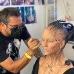 Annie Wersching Instagram - Sick of #Picard posts yet? 😉👑👽Never, you say?! Great! In honor of our panel at @wondercon today, this one goes out to the incredible artists who designed, executed and applied this tricky prosthetic. In the beginning I was called 4 hours before I was due on set. That included everything…hair in a bun, bald cap, crown on, 10 overlapping prosthetics, airbrushing and hand painting. Then costume and corset and all the rest. We very quickly got the whole shebang down to 2 1/2 hours! I’d go film some snarky BQ scenes and then it would take about 25 mins to remove the makeup pieces. I would let my hubs/family know I was almost finished by sending one of these ridiculous pics of prosthetics being cut off my face! 🤣 Some of my favorite times throughout my whole #StarTrekPicard experience were sitting in the chair being worked on by @jrmackinnon amd @kevinkirkpatrickart. I mean….what talent! And what great humans.❤️@vincentvandykefx and his team created piece after piece and @nevillepage was the concept artist for the whole thing! They did all of this while under the strictest of Covid protocols. I applaud them tremendously and I’m sure they’ll win lots of Emmys. 🏆 As they should! Don’t even get me started on @christineclarkdesign and @syzygy_designs and their ridiculously amazing detailed fittings and BQ costume…We’ll save that for next week ;) @startrek @startrekonpplus #picardbts