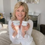 Anthea Turner Instagram - Once I knew you adored BALM 6, my plan was to create something else, equally as nourishing: Welcome BODY 3 for your - Body, Hands and Feet. This beautiful body butter is a blend of natural ingredients, expertly whipped to create a light but deeply hydrating cream to soothe, protect and brighten our skin. As you know our products work hard for their place in your life. So, like BALM 6, BODY 3 has been formulated to look after not just your body but your hands and feet too. So you have three pots in one, with our signature aroma of Lemongrass, Rosemary and Vanilla. Nothing else will feel as good as this it’s a joy to use and I know you’ll love it as much as I do What is in the pot? Sweet Almond Oil Used for centuries to help soothe and soften skin and treat minor wounds and cuts. Shea Butter Cocoa Butter Coconut Oil Strawberry Fruit Oil Strawberries are packed with a high antioxidant content which protects and brightens the skin. They are rich in Omega 6 and 9 which helps to form a barrier, locking in moisture. As it’s a dry oil it absorbs into the skin, leaving no residue. To order BODY 3 head to the link in my bio 🫶🏼 White shirt @countryconnections