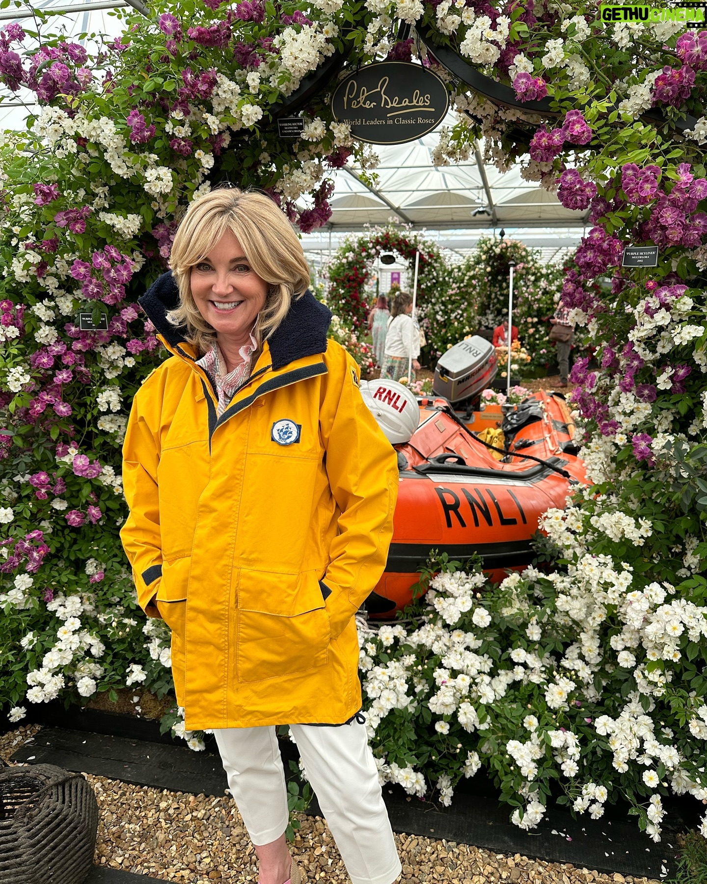 Anthea Turner Instagram - Few pictures here to show you one of my big reasons for popping over to @rhschelsea this year. It was to help champion rose breeder Ian Limmer of @peterbealesroses launch his new baby. This beautiful cluster rose called ‘With Courage’ will help raise ‘hopefully’ around 40k for the @rnli As you know, Blue Peter has a long history of support for the RNLI During my time on the show I took part in many of their training exercises, so many in fact I had my own uniform!! 30 years later I wore it proudly again and for the last time as I’ve donated it compleat with badges to the RNLI Museum in Tenby Pembrokeshire - The place aged 6 with Dad I watched my first launch. It’s not there yet but when it is I’ll feel very proud 😊 Obviously the BP fam were also there to help and just great to be with @lindseyjrussell and @missjanetellis Also a delight to meet another supporter @joannascanlanofficial 🎭 What a team !!🌺🌺🌺🌺