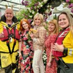 Anthea Turner Instagram - Few pictures here to show you one of my big reasons for popping over to @rhschelsea this year. It was to help champion rose breeder Ian Limmer of @peterbealesroses launch his new baby. This beautiful cluster rose called ‘With Courage’ will help raise ‘hopefully’ around 40k for the @rnli As you know, Blue Peter has a long history of support for the RNLI During my time on the show I took part in many of their training exercises, so many in fact I had my own uniform!! 30 years later I wore it proudly again and for the last time as I’ve donated it compleat with badges to the RNLI Museum in Tenby Pembrokeshire - The place aged 6 with Dad I watched my first launch. It’s not there yet but when it is I’ll feel very proud 😊 Obviously the BP fam were also there to help and just great to be with @lindseyjrussell and @missjanetellis Also a delight to meet another supporter @joannascanlanofficial 🎭 What a team !!🌺🌺🌺🌺